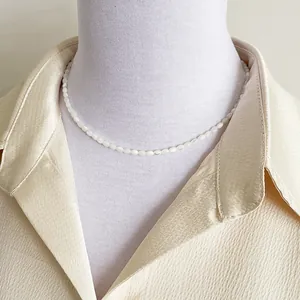 Elegant shell bead necklace on mannequin for beach style and minimalist fashion look