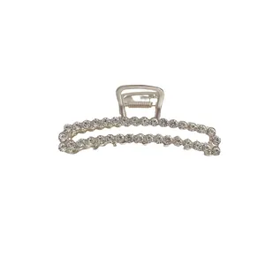 Elegant silver metal hair claw clip with rhinestones in an oval hollowed-out design