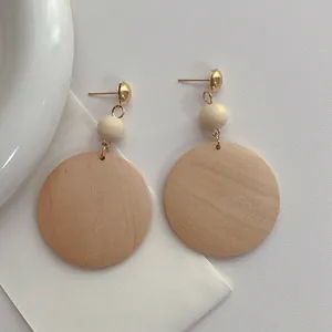 Bohemian large wooden hoop dangle earrings with natural grain and gold metal connectors