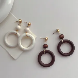 Minimalist bohemian vintage wood hoop earrings in white and walnut brown with gold studs