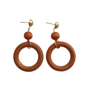 Vintage round wood drop earrings with golden metal studs and bohemian wood grain texture