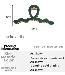 Detailed view of dark green acetate hair claw with 12cm size dimensions and weight info