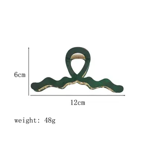 Detail showing 12cm dark green acetate hair claw clip with wave design dimensions