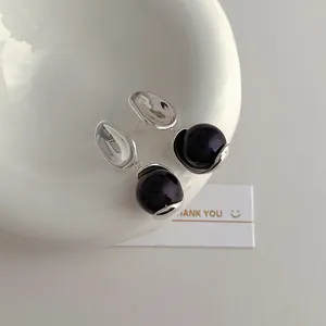 Artistic silver irregular hoop earrings with deep purple circular bead pendants