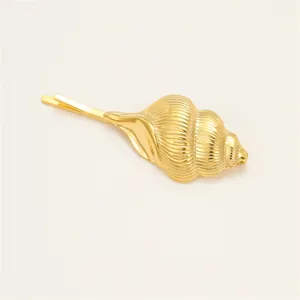 Golden seashell bobby pin featuring a realistic shell design with elegant pearl accent