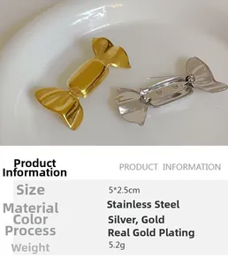 Detail view of candy-shaped gold and silver stainless steel pins in a ceramic tray