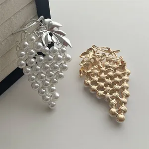 Vintage grape-shaped brooch with metal leaves and elegant white pearls for suits