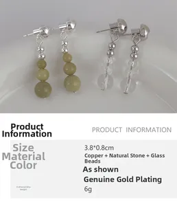 Detail view of avocado green stone tassel earrings with dimensions 3.8x0.8cm and 6g weight