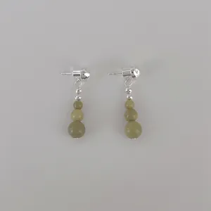 Detailed view of avocado green stone beaded tassel earrings with S925 silver studs