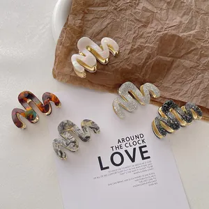 Five-piece set of elegant wave-shaped acetate and metal hair claws in diverse patterns