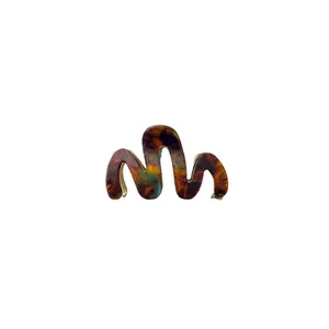 Wavy tortoiseshell acetate hair claw clip with golden metal base for women's hairstyle