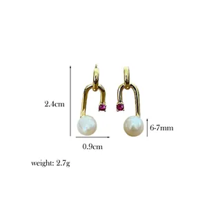 Detail view of gold U-shaped pearl earrings with dimension markings and weight specifications