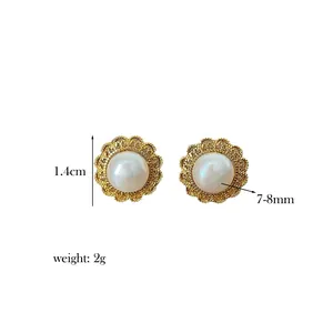 Detail view showing 1.4cm hollow petal gold earrings with 8mm natural freshwater pearls