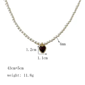 Detail view of heart pendant pearl necklace with 43cm chain and 1.1cm dimensions