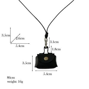 Mini black leather coin purse necklace with dimensions and bronze snap button detail