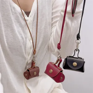 Mini leather coin purse necklace for women in brown, burgundy and black colors