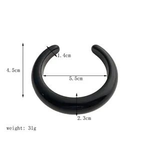 Detail view of black resin open cuff bracelet with precise size measurements and dimensions