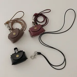 Mini leather necklace wallet for earbuds and coins in brown, burgundy, and black colors