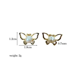 Detailed size view of gold butterfly earrings with natural pearls and s925 silver posts