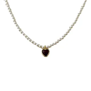 French vintage pearl necklace with a gold-edged red agate heart pendant for women