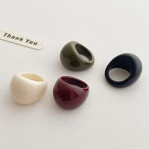Minimalist resin rings in ivory, olive green, burgundy, and black with high gloss finish
