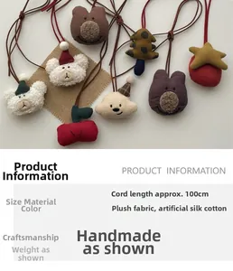 Detailed view of handmade plush charms featuring bears and clouds with soft fabric texture