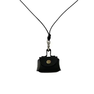 Mini black leather coin purse necklace with metal snap and adjustable neck lanyard