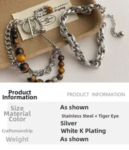 Dettaglio del bracciale doppio in acciaio argento con perline occhio di tigre e chiusura OT
