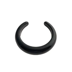 Minimalist black resin open cuff bracelet with polished finish and geometric design