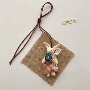 Cute handmade plush rabbit necklace with red plaid dress and brown leather chain