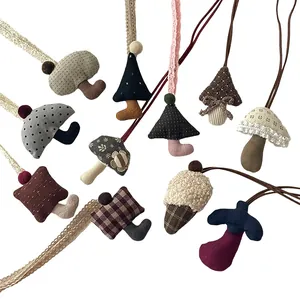 Cute handcrafted mushroom fabric pendants in various patterns with lace hanging straps