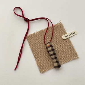 Handmade fabric cartoon kitten pendant with brown plaid pattern and red drawstring cord