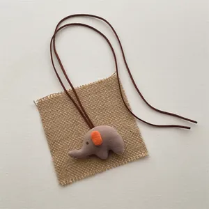 Handmade 3D elephant doll necklace with grey fabric pendant and brown cord strap
