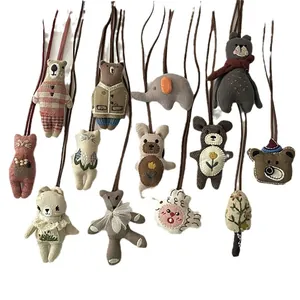 Collection of handmade plush animal charms featuring bears and elephants with long lanyards