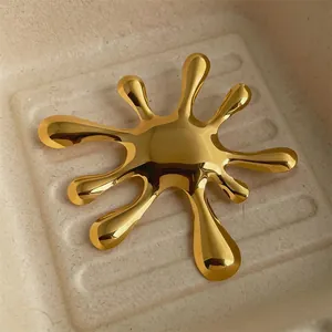 Retro golden hollow round brooch with irregular sunburst water ripple metallic texture