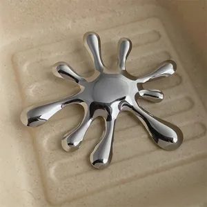 Retro hollow circular silver brooch with irregular liquid texture in a minimalist metal design