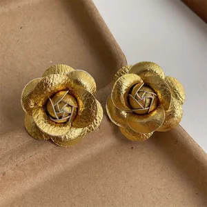 Elegant gold fabric rose stud earrings with s925 silver needles for a vintage luxury look