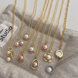 Elegant gold and silver freshwater pearl necklaces set with various charms on a linen bag