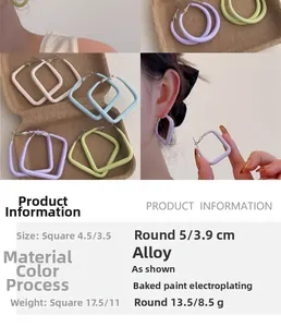 Macro shot of macaron colored geometric earrings with smooth lacquered alloy finish