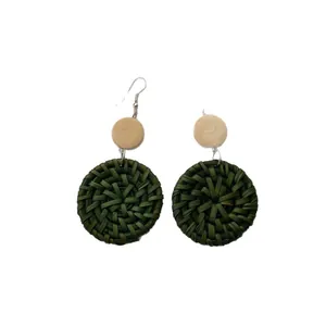 Handmade bohemian rattan earrings with dark green weave and natural wood circles