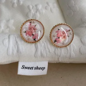 French vintage enamel flower studs with pearls and golden twisted edge in resin