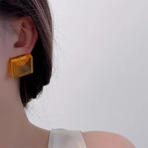 Chic amber acrylic cube stud earrings for women featuring a modern geometric square design