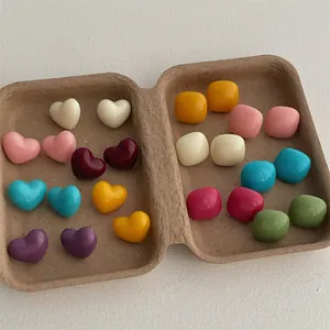 Colorful candy-colored heart and square stud earrings set in various pastel hues