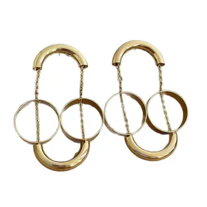Orecchini alla moda color oro con doppio cerchio e frange dal design geometrico a U