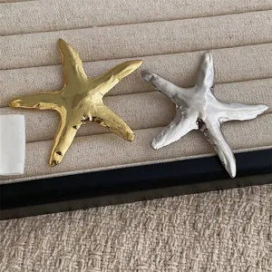 Elegant gold and silver metallic starfish brooches with handcrafted hammered texture finish