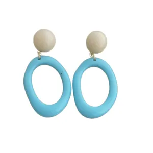 Retro geometric resin earrings featuring beige studs and sky blue oval drop hoops