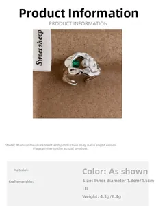 Detail of vintage irregular silver ring with green zircon, pearl and size parameters