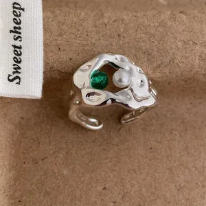 Retro silver adjustable ring with irregular texture, green zircon, and white pearl