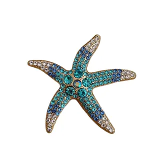 Sparkling starfish brooch pin with blue gradient crystals for T-shirts and sweaters