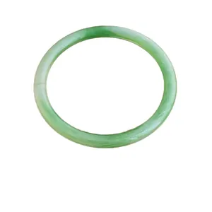 Minimalist light green jade style bangle with a classic round profile on white background